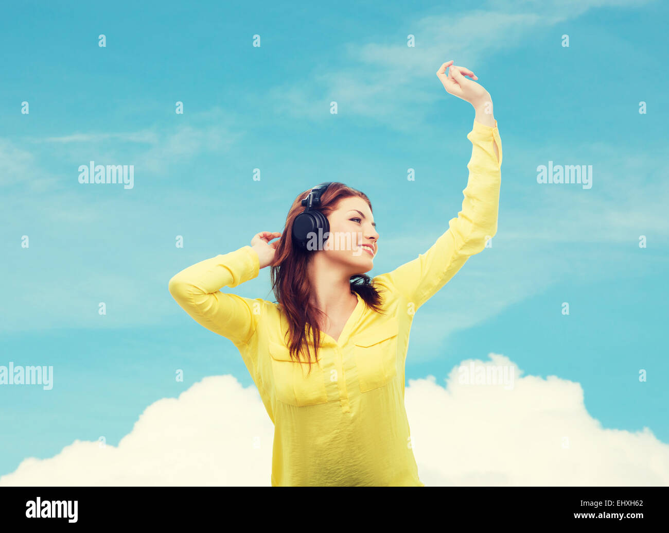 teenage girl sitting on sofa with headphones Stock Photo - Alamy