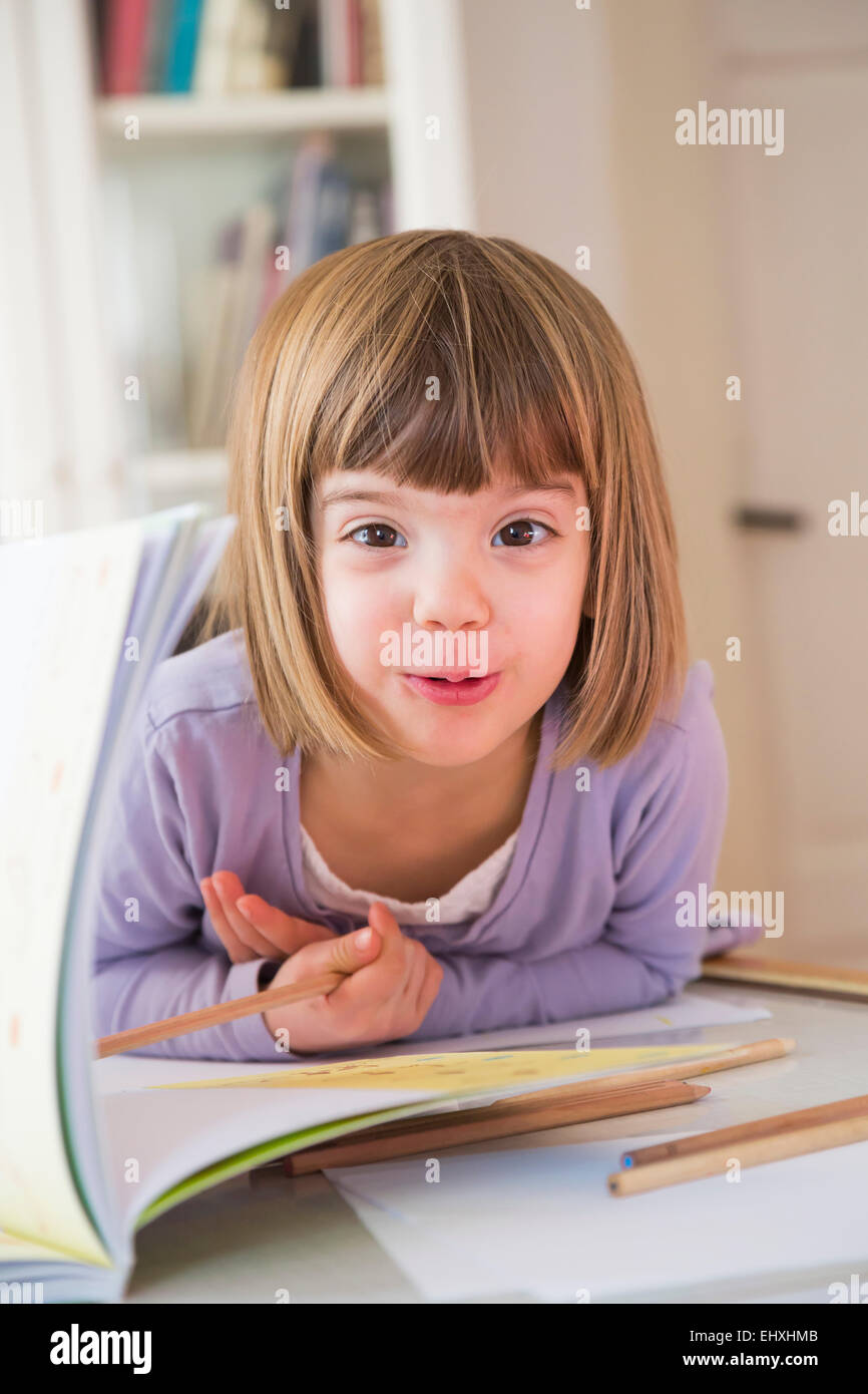Portrait of little girl with coloured pencils Stock Photo - Alamy