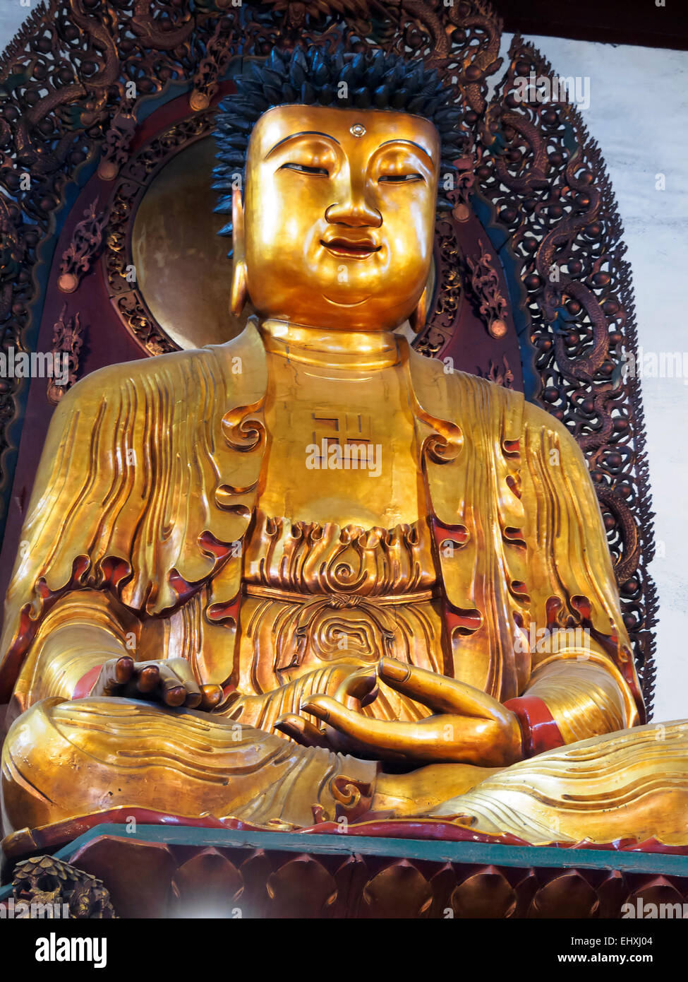Golden statue of sitting Buddah at the Jade Buddha temple in Shanghai