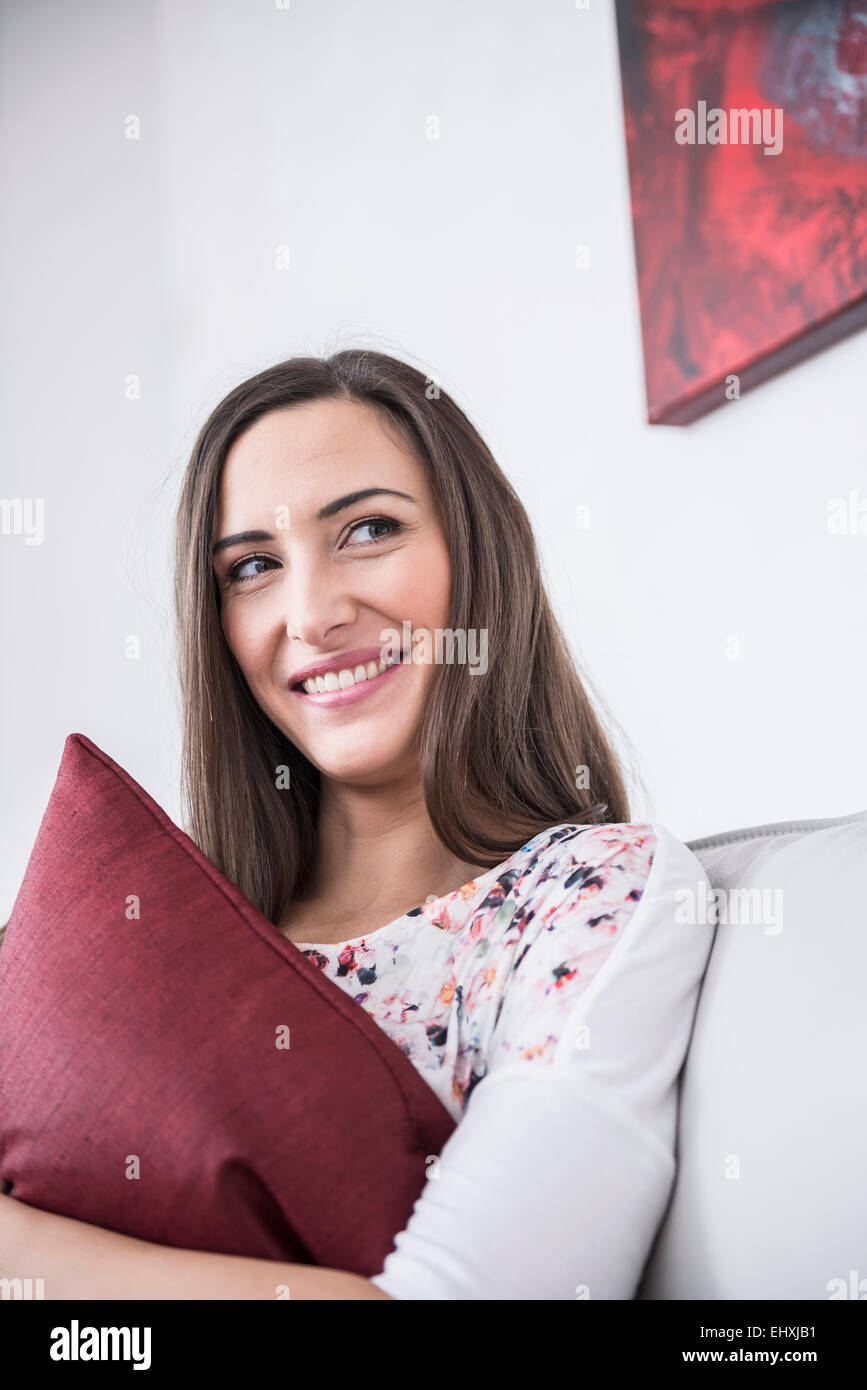 Woman sitting relaxed sofa hi-res stock photography and images - Alamy
