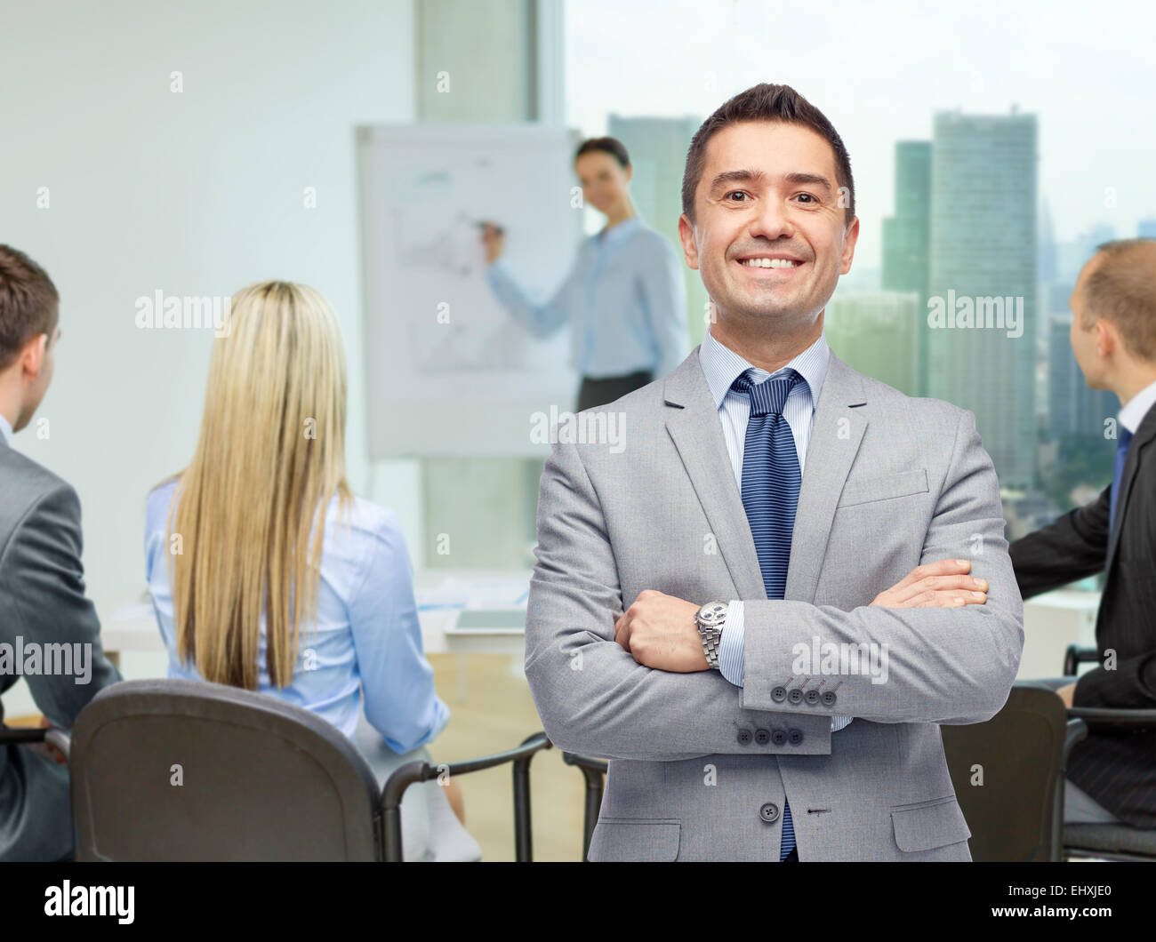 happy smiling business team over office room Stock Photo - Alamy