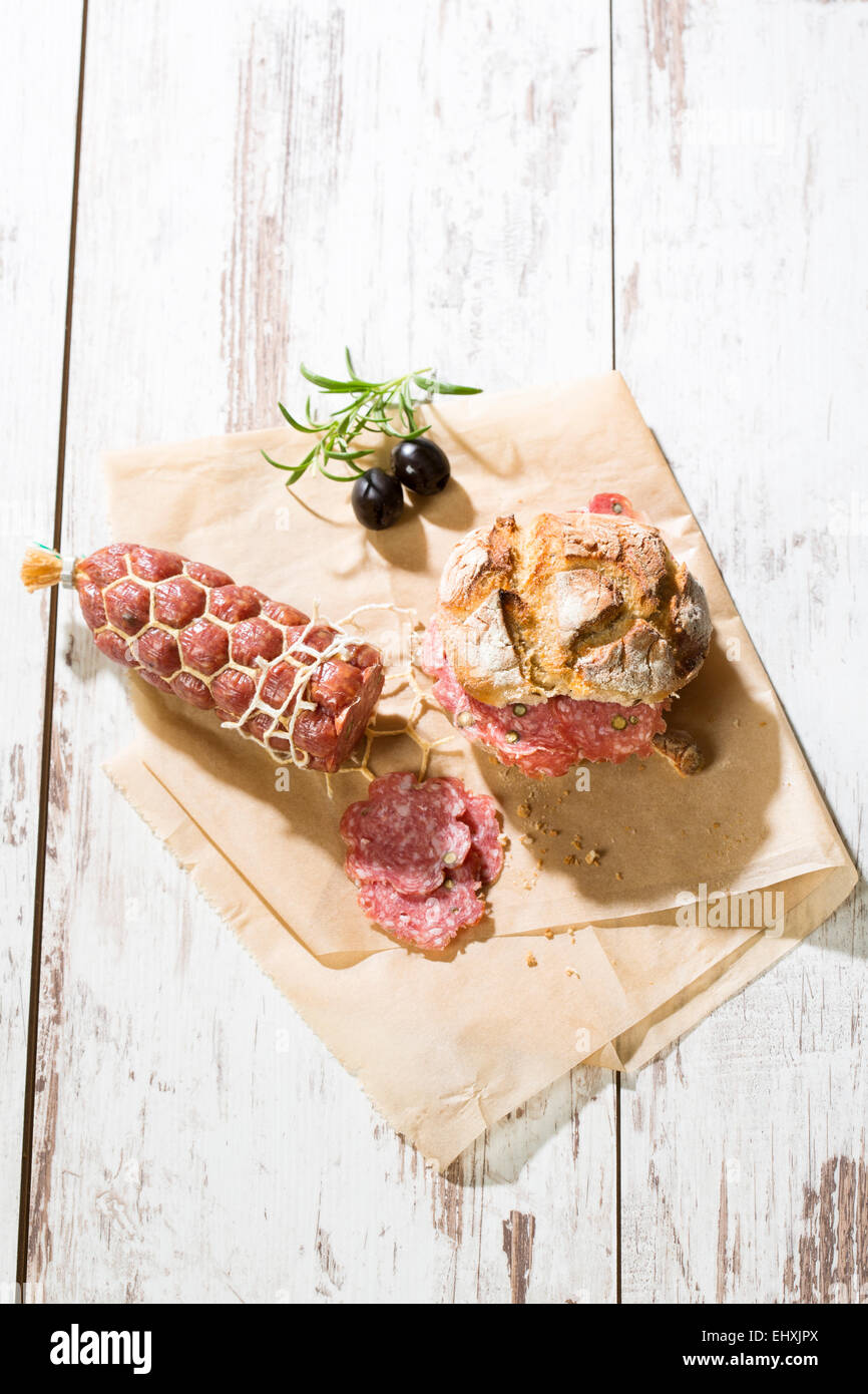 Salami and bread roll Stock Photo Alamy