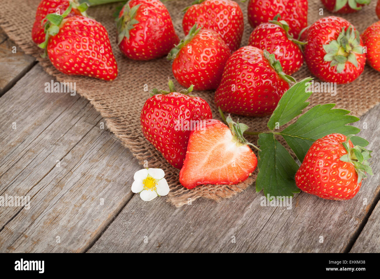 Fresh strawberry over wooden table Stock Photo - Alamy
