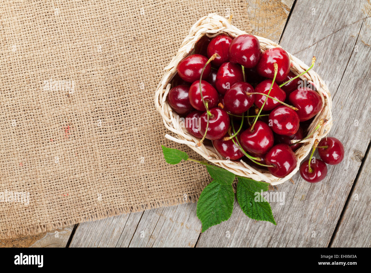 Ripe cherries on wooden table. View from above with copy space Stock ...