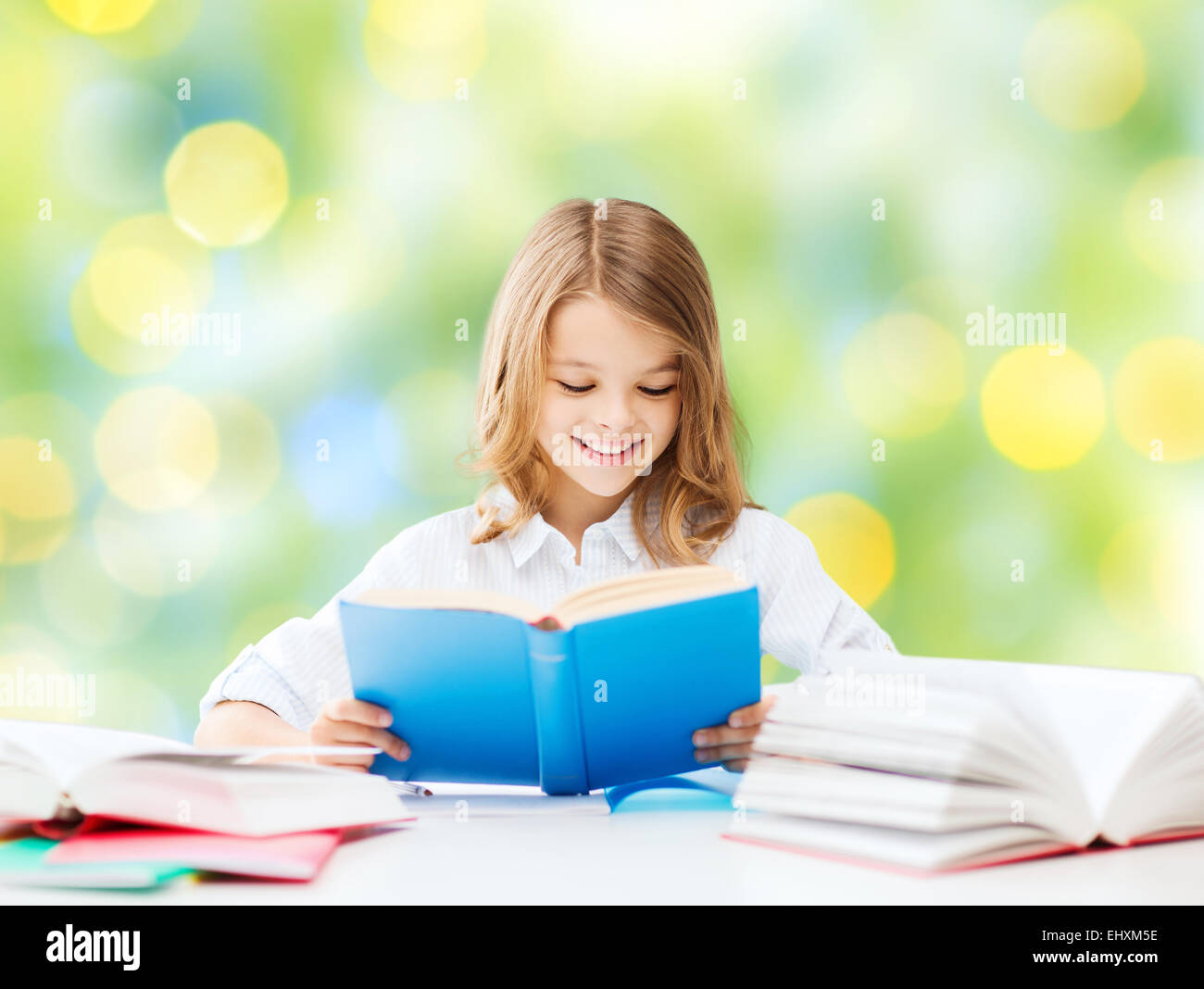happy student girl reading book at school Stock Photo - Alamy