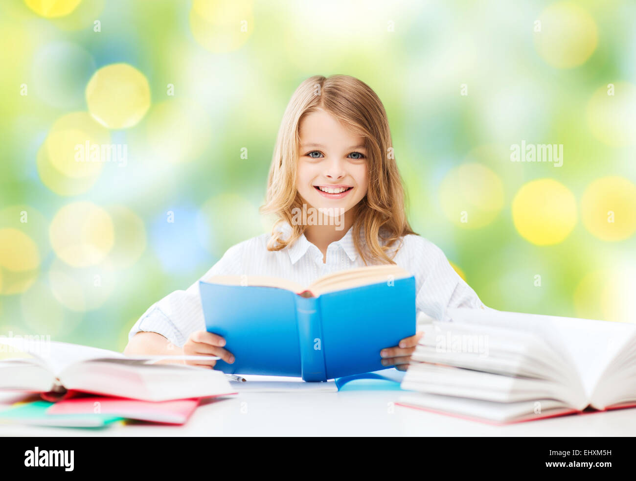 happy student girl reading book at school Stock Photo - Alamy