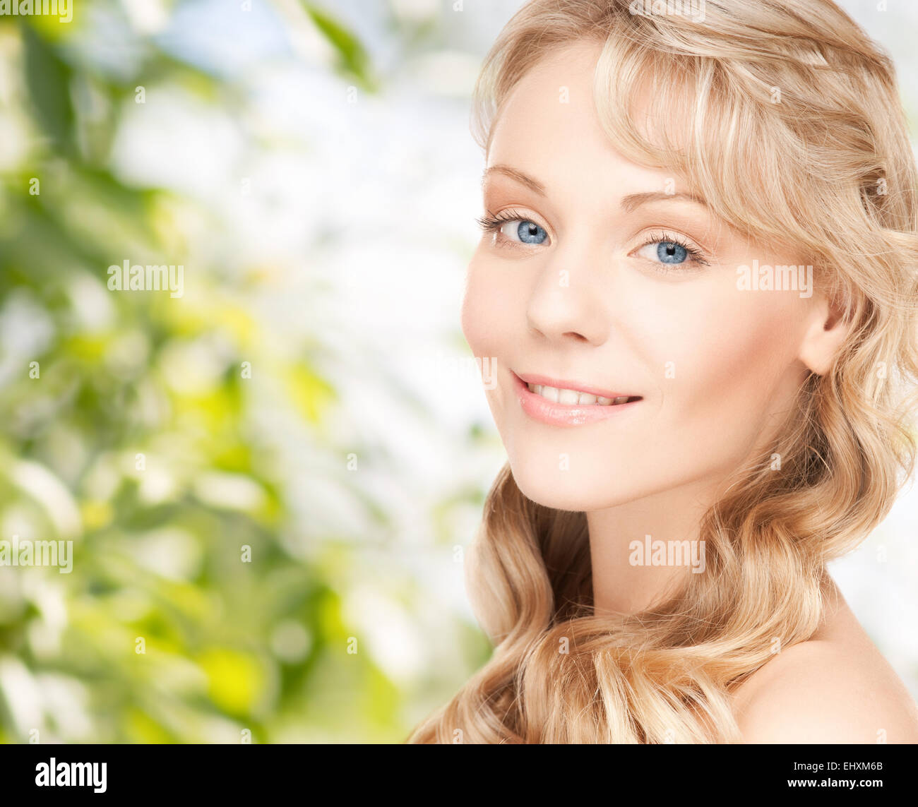 beautiful young woman face with long wavy hair Stock Photo - Alamy