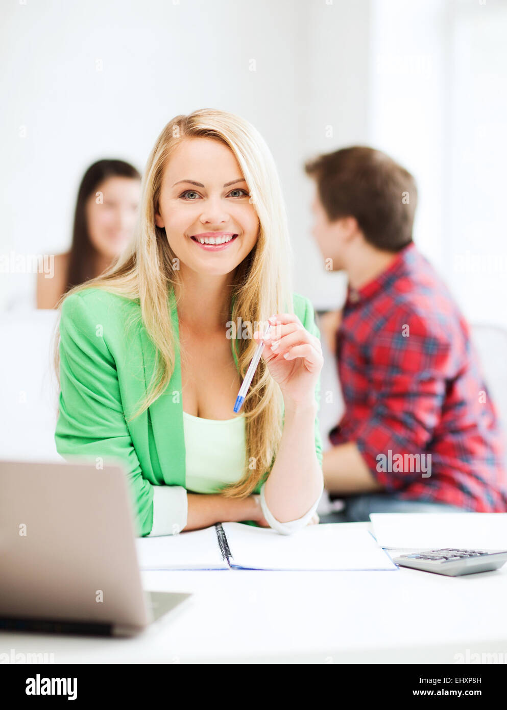smiling student girl with laptop at school Stock Photo - Alamy