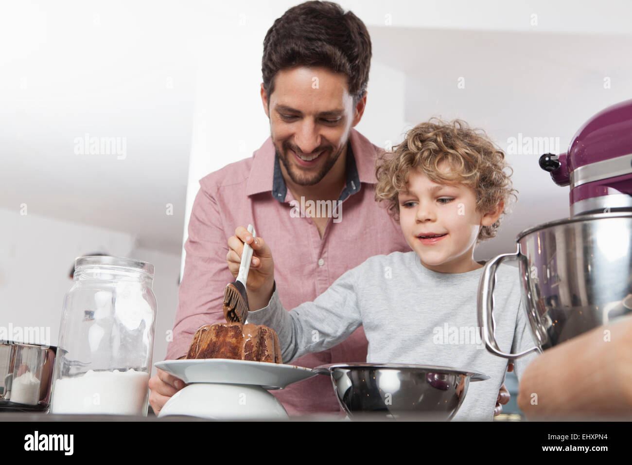 Father And Son Baking In Kitchen Stock Photo Alamy