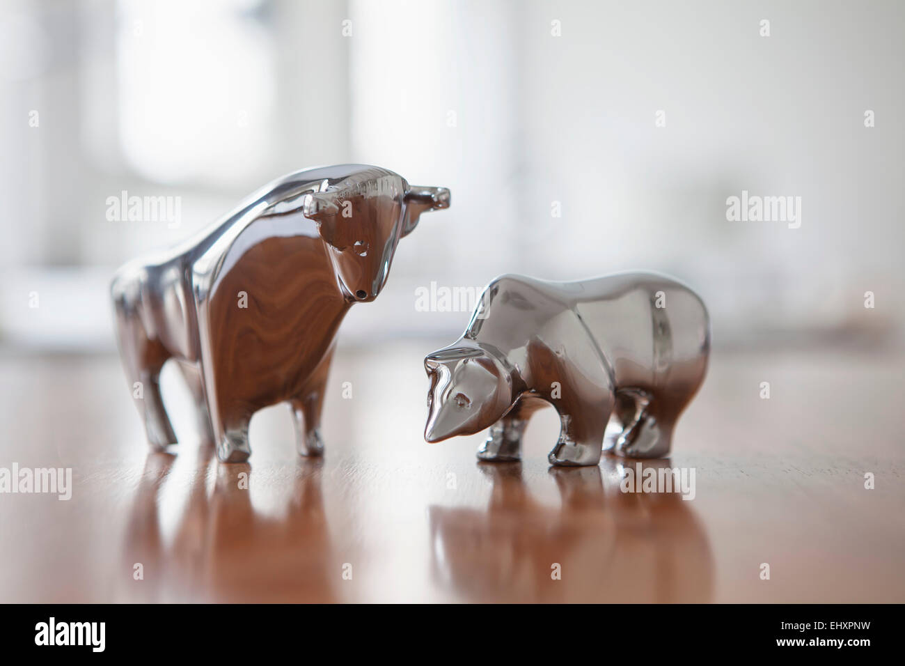 Miniature sculptures of bull and bear on a desk Stock Photo Alamy