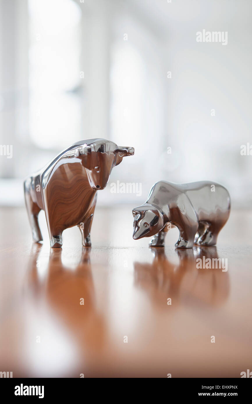 Miniature sculptures of bull and bear on a desk Stock Photo Alamy
