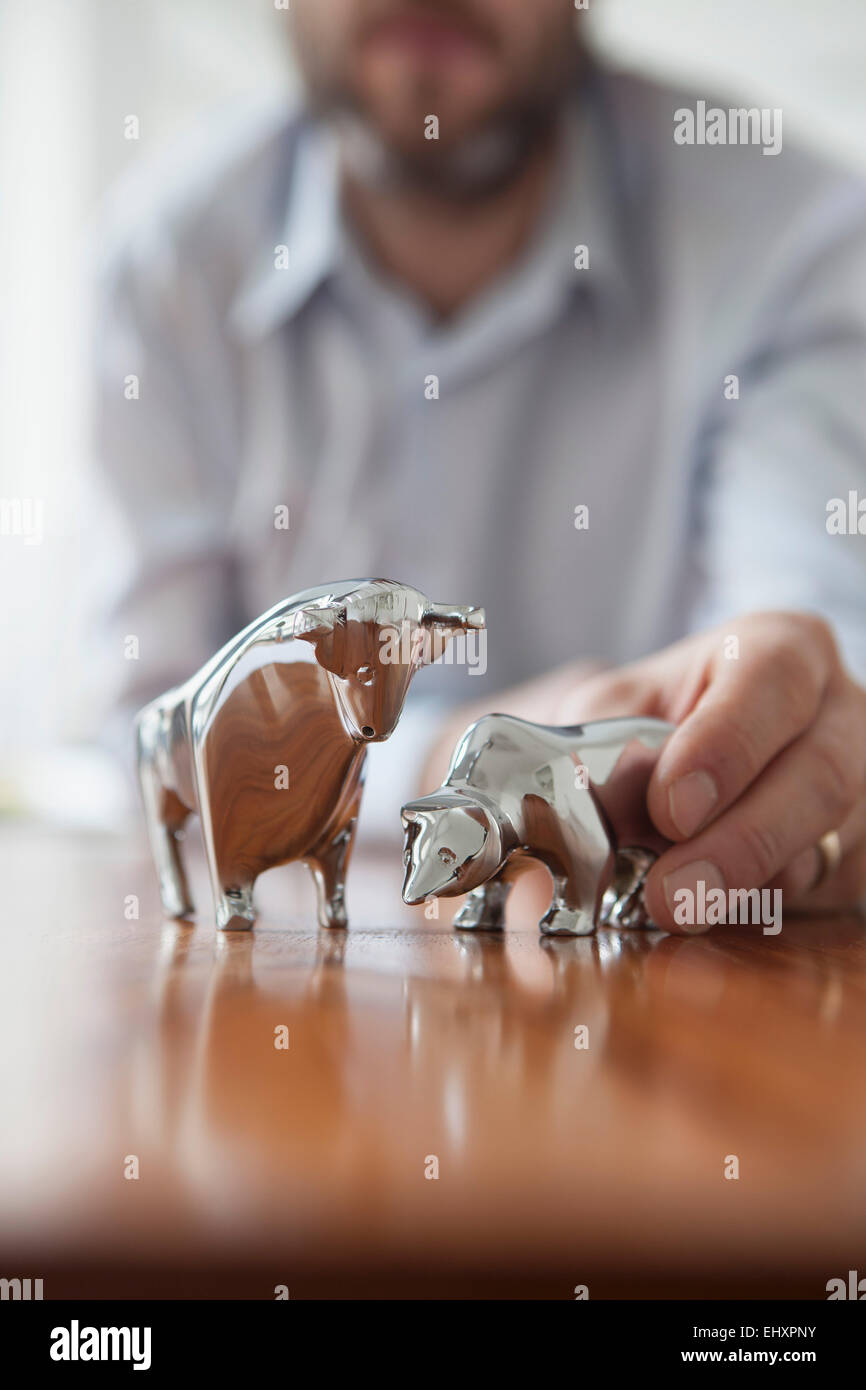 Miniature sculptures of bull and bear on a desk Stock Photo Alamy