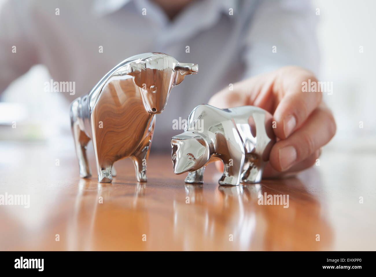 Miniature sculptures of bull and bear on a desk Stock Photo Alamy