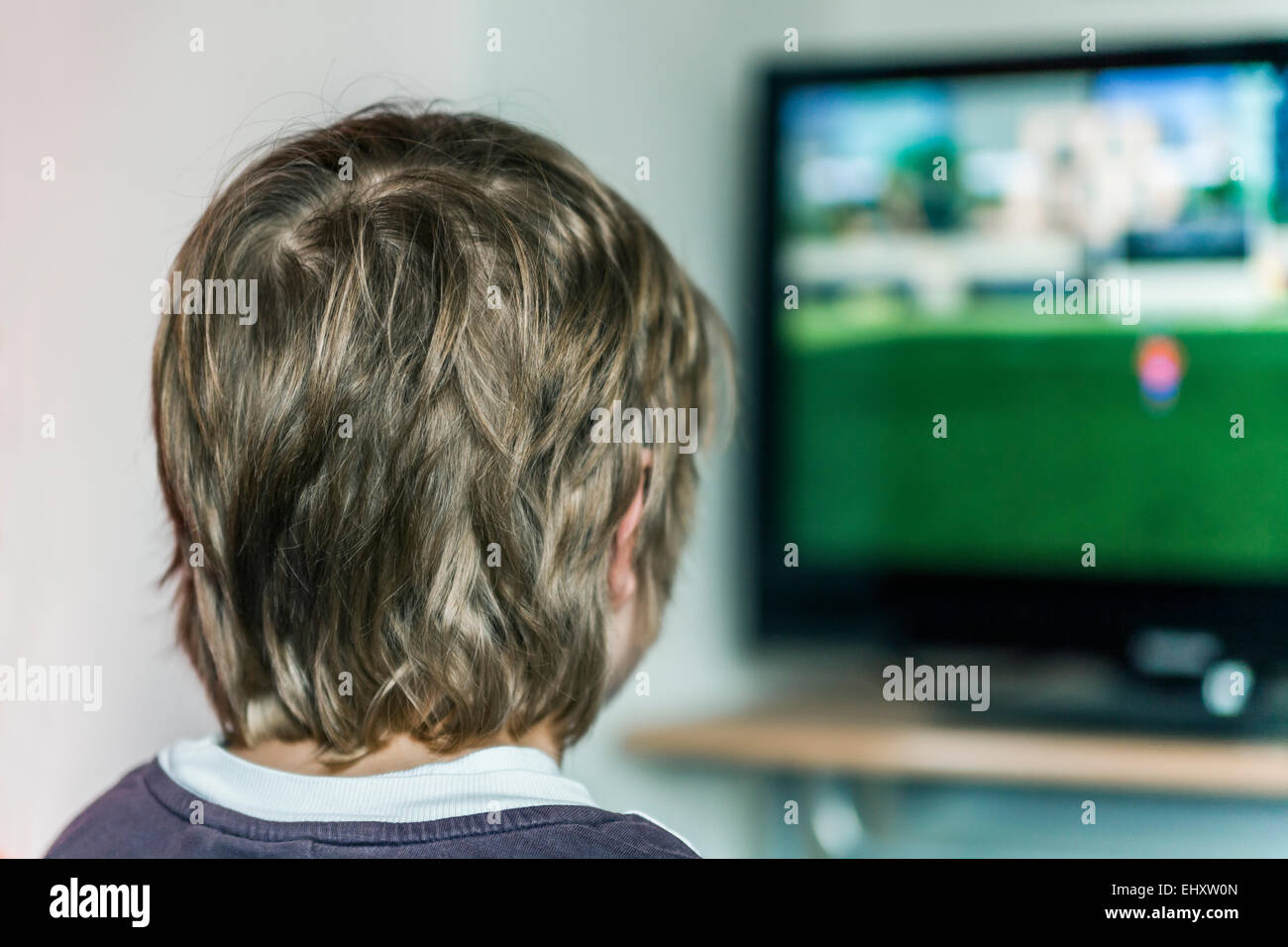 Boy watching at monitor playing computer game Stock Photo