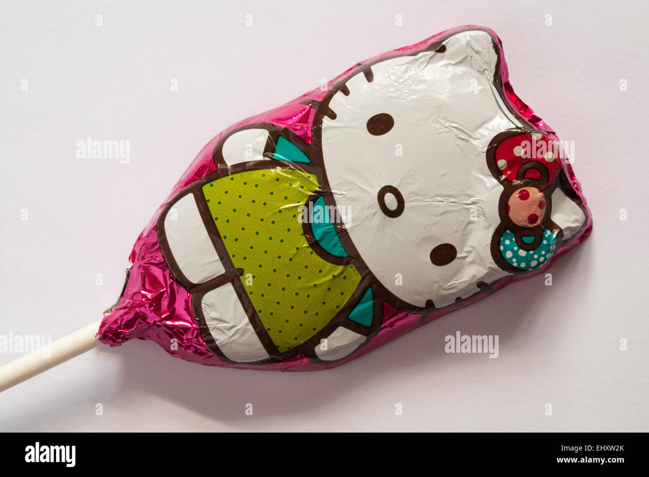solid milk chocolate Hello Kitty lolly on white background Stock Photo
