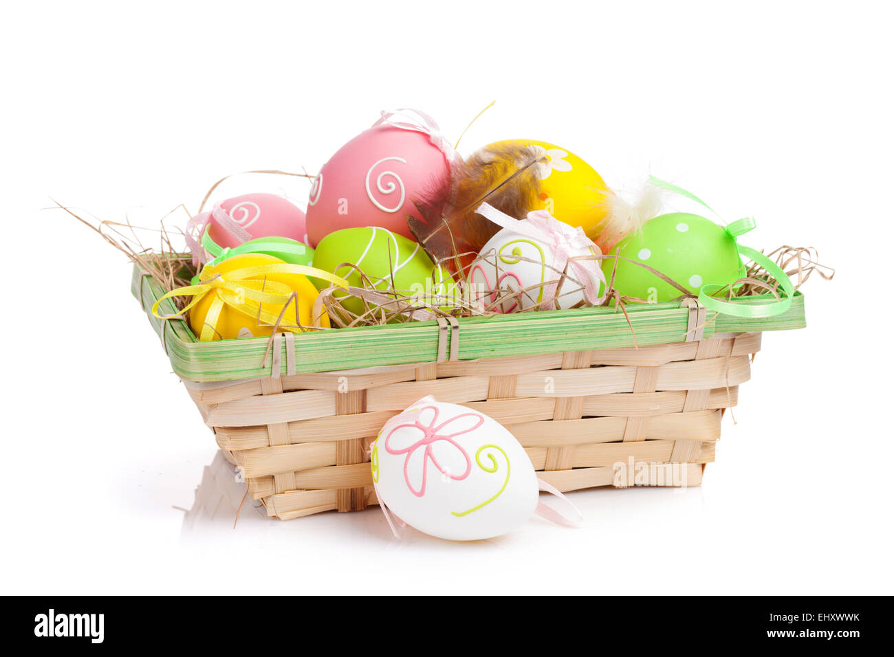 Easter eggs basket. Isolated on white background Stock Photo - Alamy