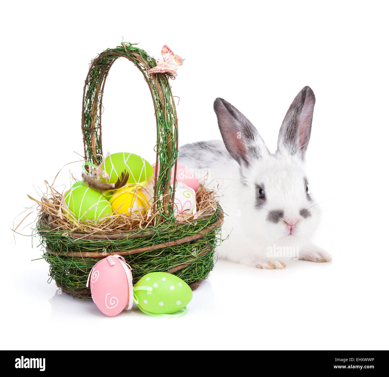Easter eggs basket and rabbit. Isolated on white background Stock Photo ...