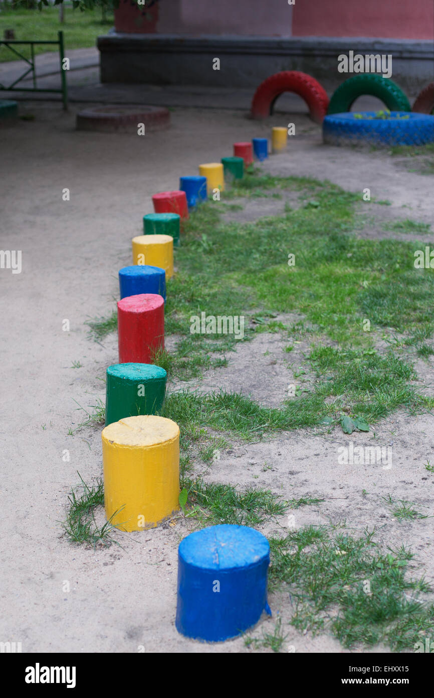 Colored wooden columns on the playground. Selective focus Stock Photo
