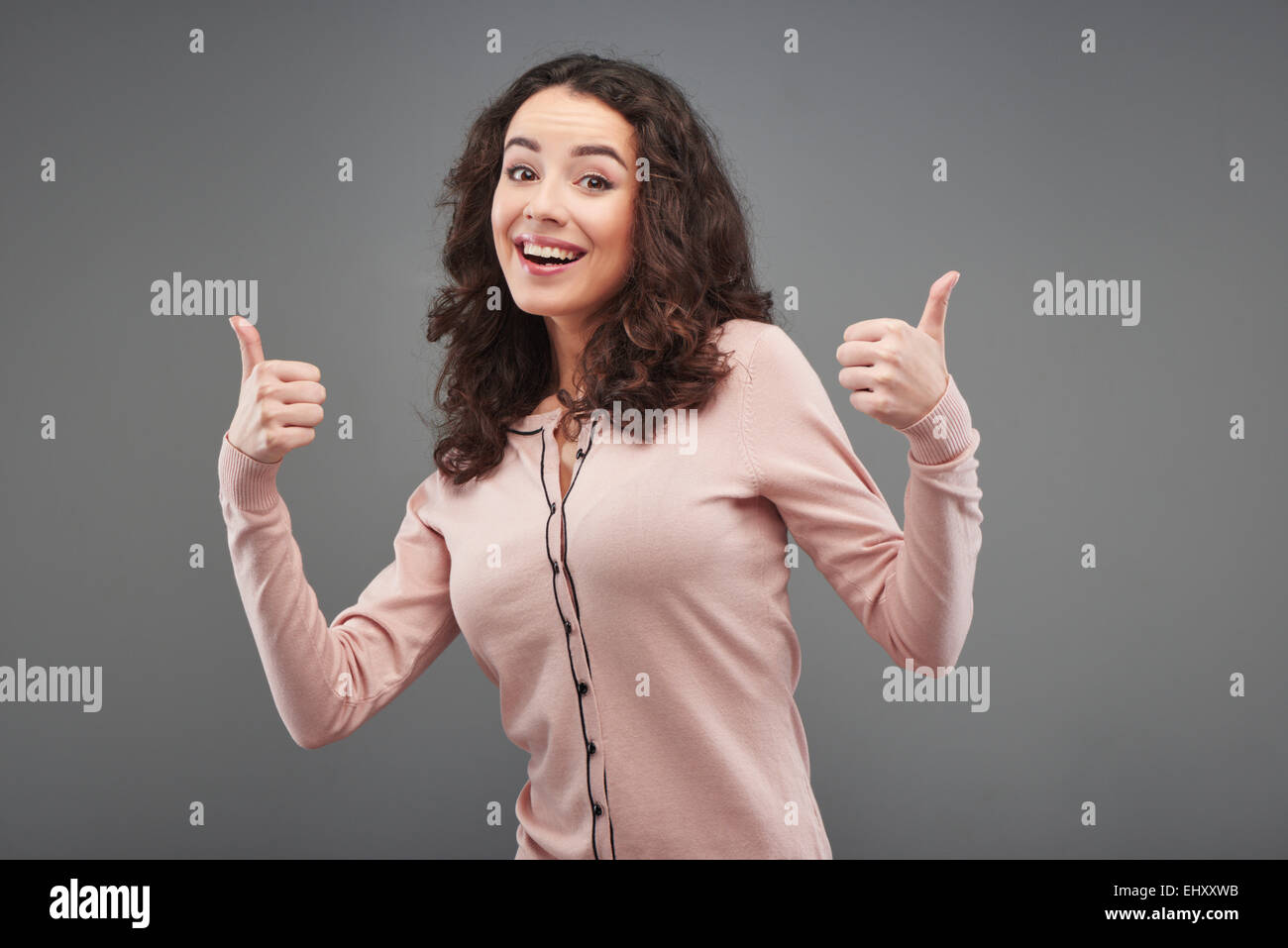 Beautiful women showing thumbs up hi-res stock photography and images ...