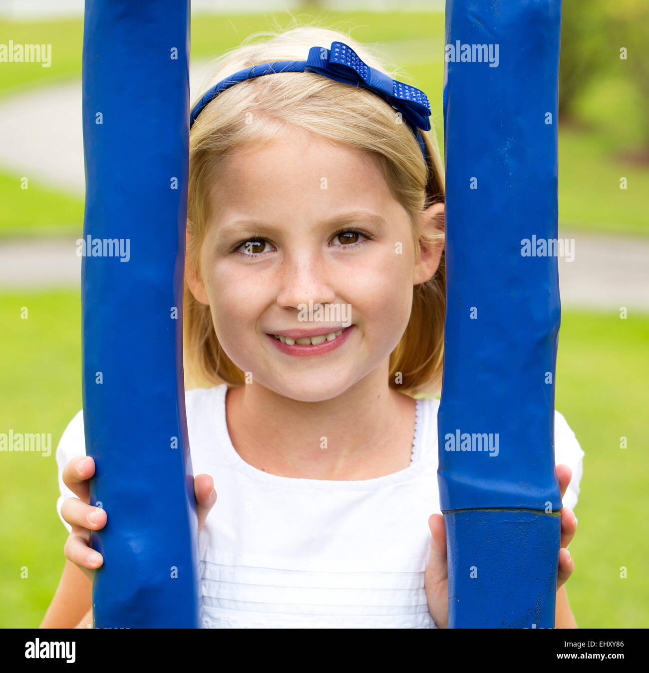 Portrait of smiling little girl on a playground Stock Photo - Alamy