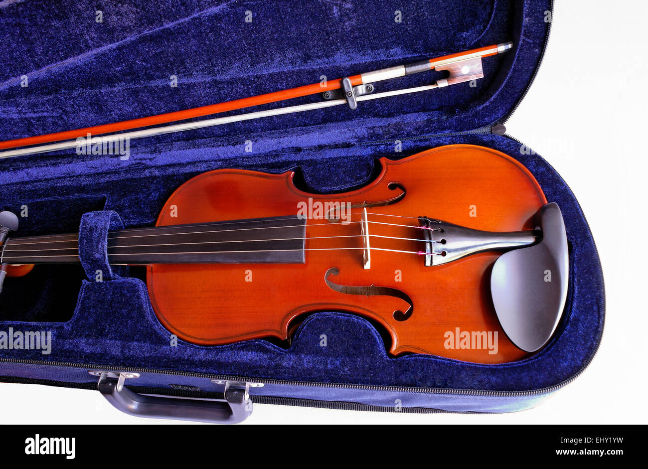 Musical instruments: violin and bow in its blue lined case closeup Stock Photo