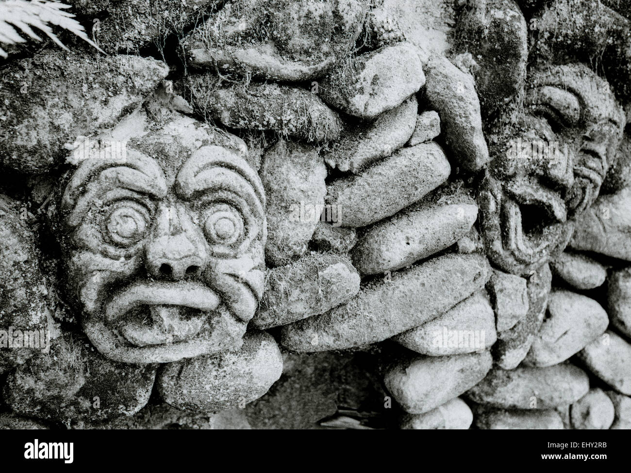 Stone wall sculpture Ubud in Bali in Indonesia in Southeast Asia. Architecture Art Stonework Building Face Gargoyle Humor Humour Funny Travel Stock Photo