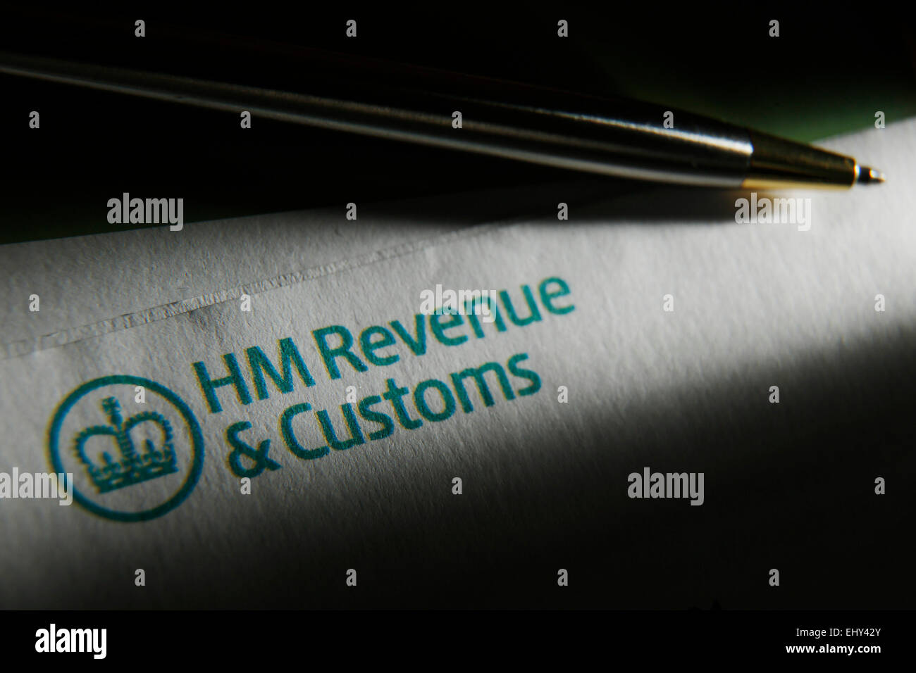 A pen is pictured on an HM Revenue and Customs logo on a self assesment tax statement Stock Photo