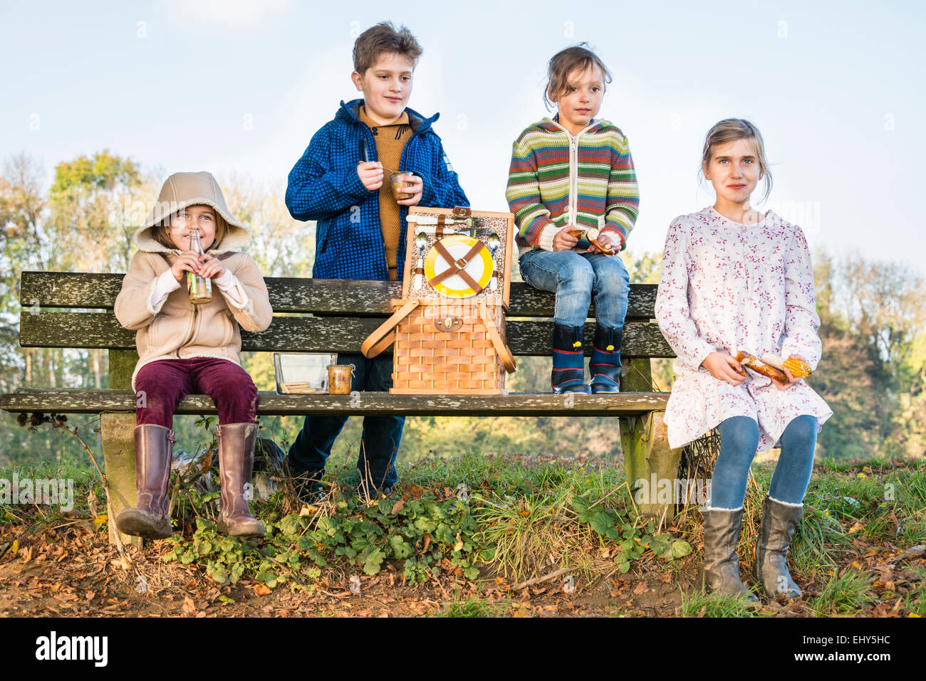 Children having picnic outdoors Stock Photo