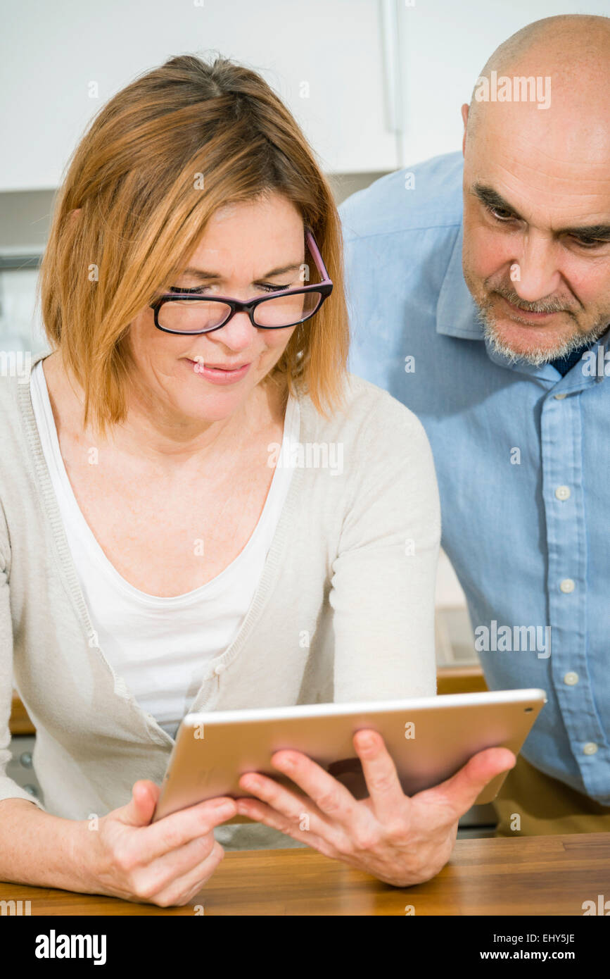 Senior couple using digital tablet Stock Photo