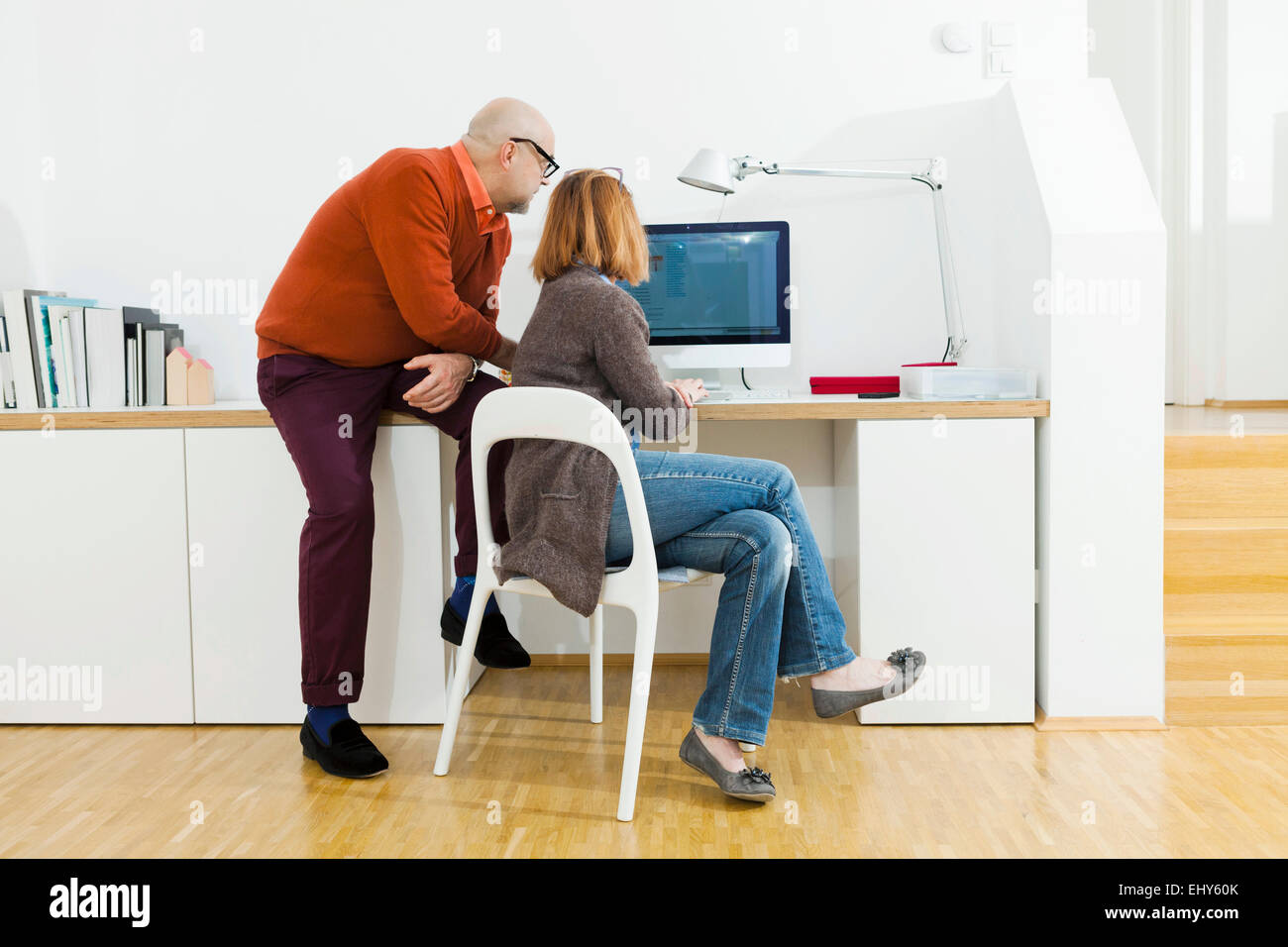 Senior couple using computer at home Stock Photo