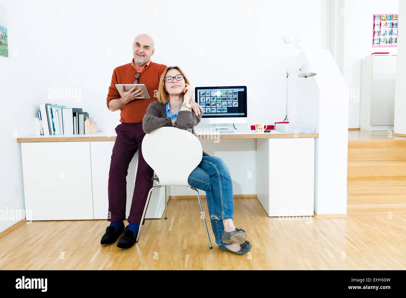 Senior couple using computer at home Stock Photo