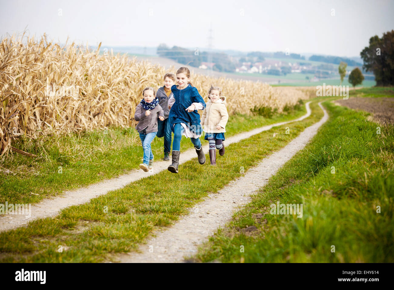 Four children playing outdoors Stock Photo