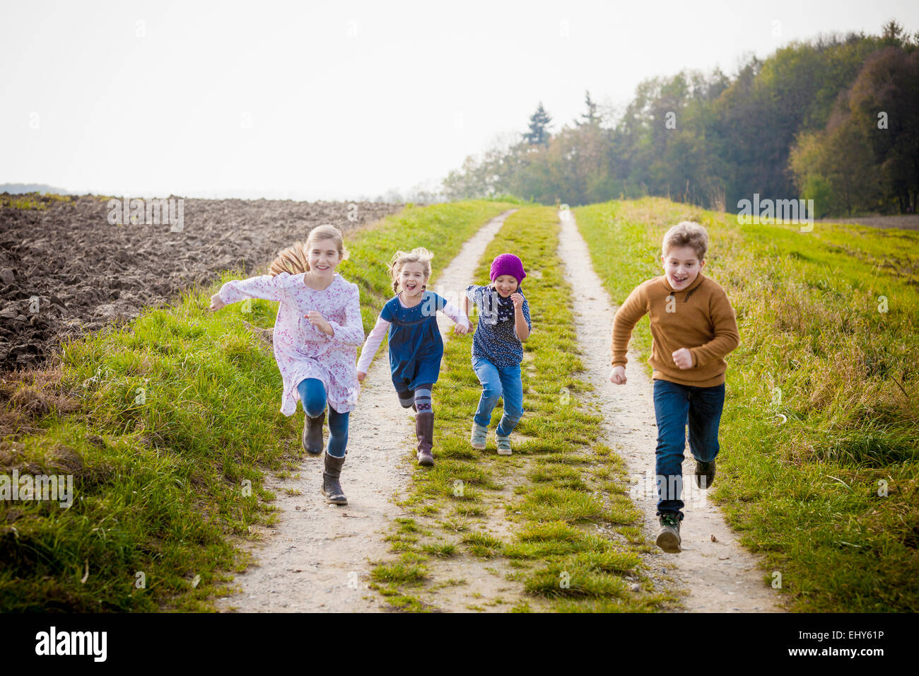 Children running on path Stock Photo