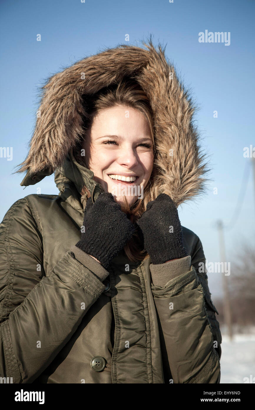 Young woman wearing hooded jacket, portrait Stock Photo Alamy