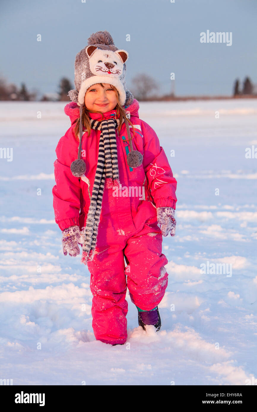 Little girl in snowy landscape Stock Photo - Alamy
