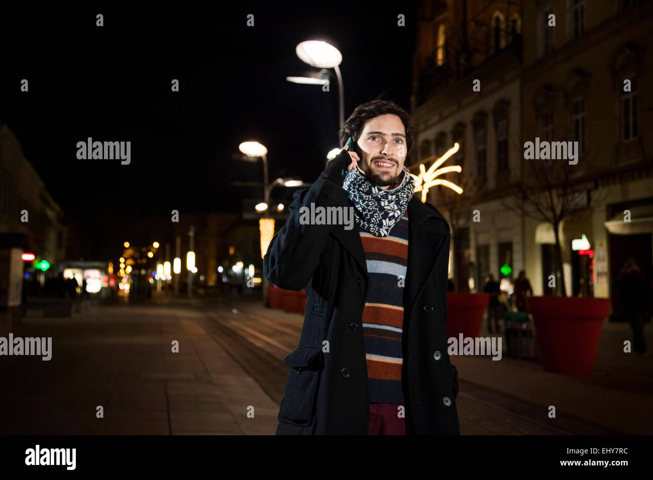 Portrait of young man using phone in city Stock Photo