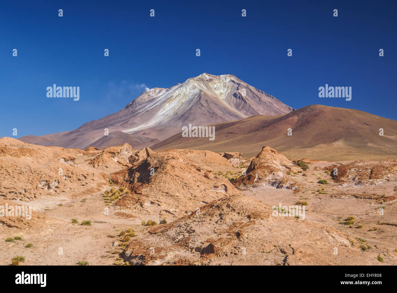 Scenic volcano near salt planes Salar de Uyuni in bolivian desert Stock Photo