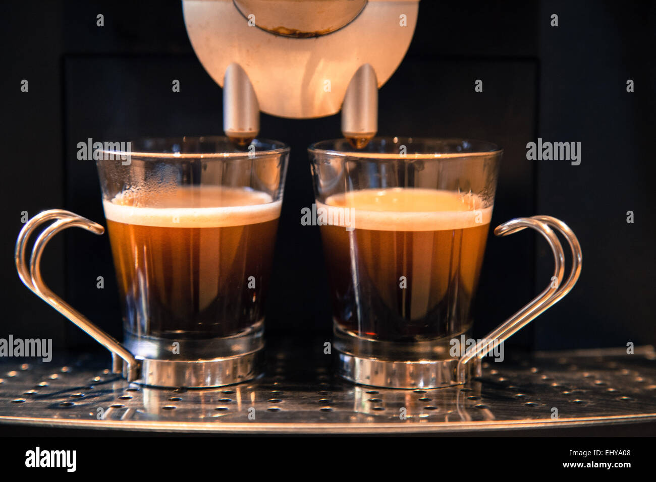 two cups of freshly brewed espresso coffee, ready to drink and enjoy