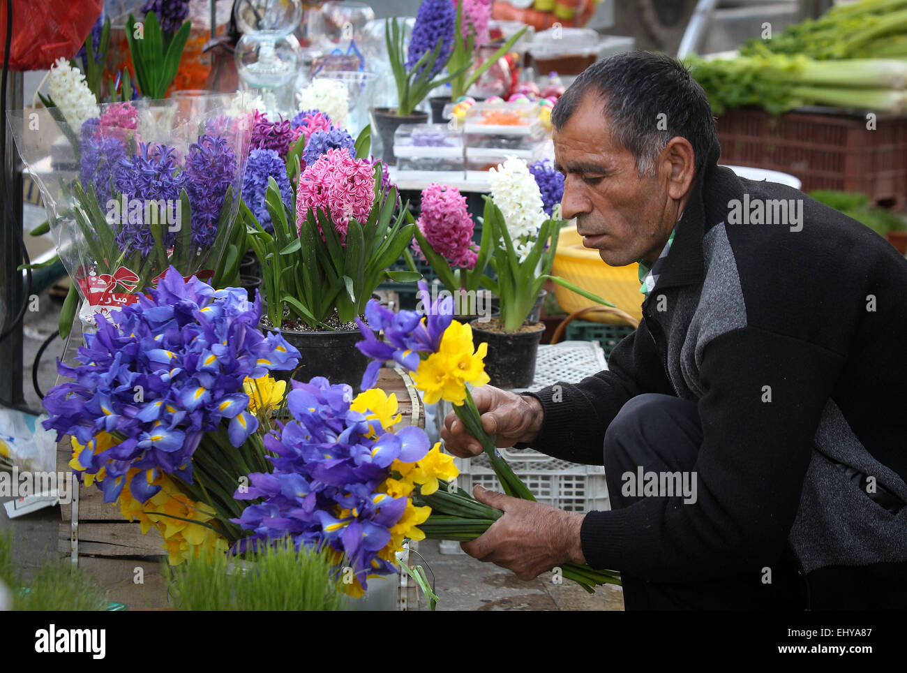 Tehran, Iran. 18th Mar, 2015. A vendor arranges flowers ahead of