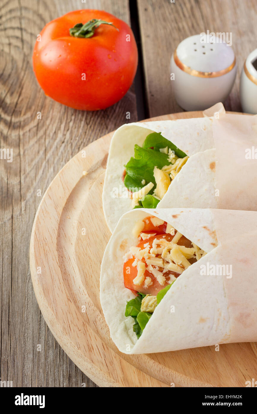 Shot of chicken fajitas on wooden plate Stock Photo