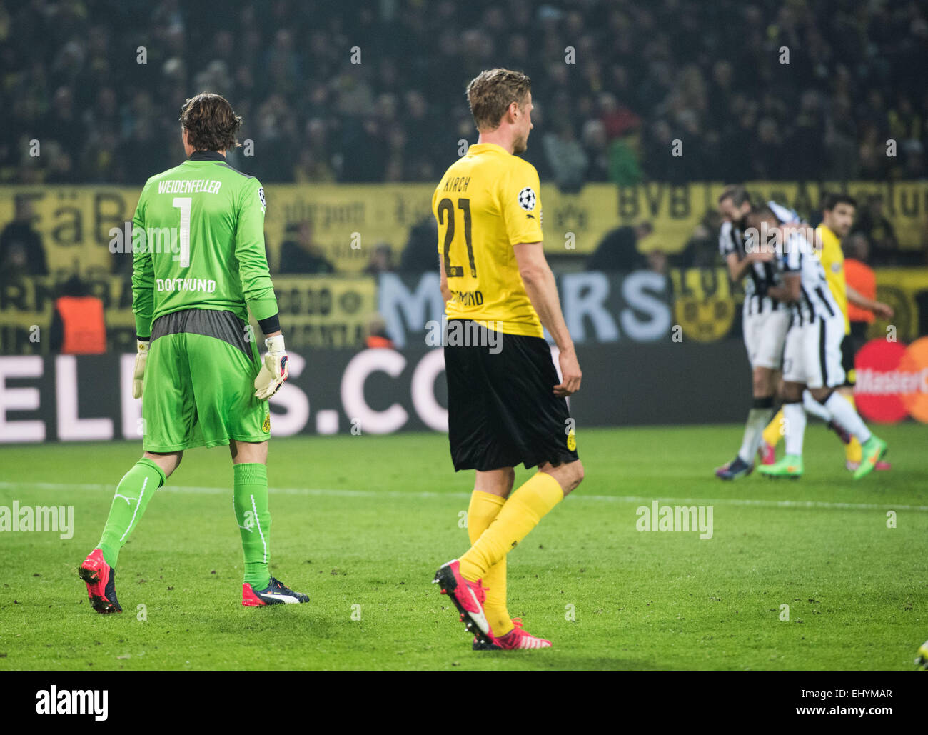 Dortmund's Roman Weidenfeller (l) and Oliver Kirch  react during the Champions League Round of Sixteen soccer match Borussia Dortmund vs Juventus Turin in Dortmund, Germany, 18 March 2015. Photo: Bernd Thissen/dpa Stock Photo
