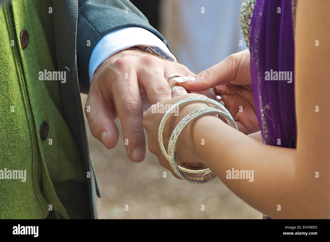 Couple exchanging rings at wedding ceremony Stock Photo