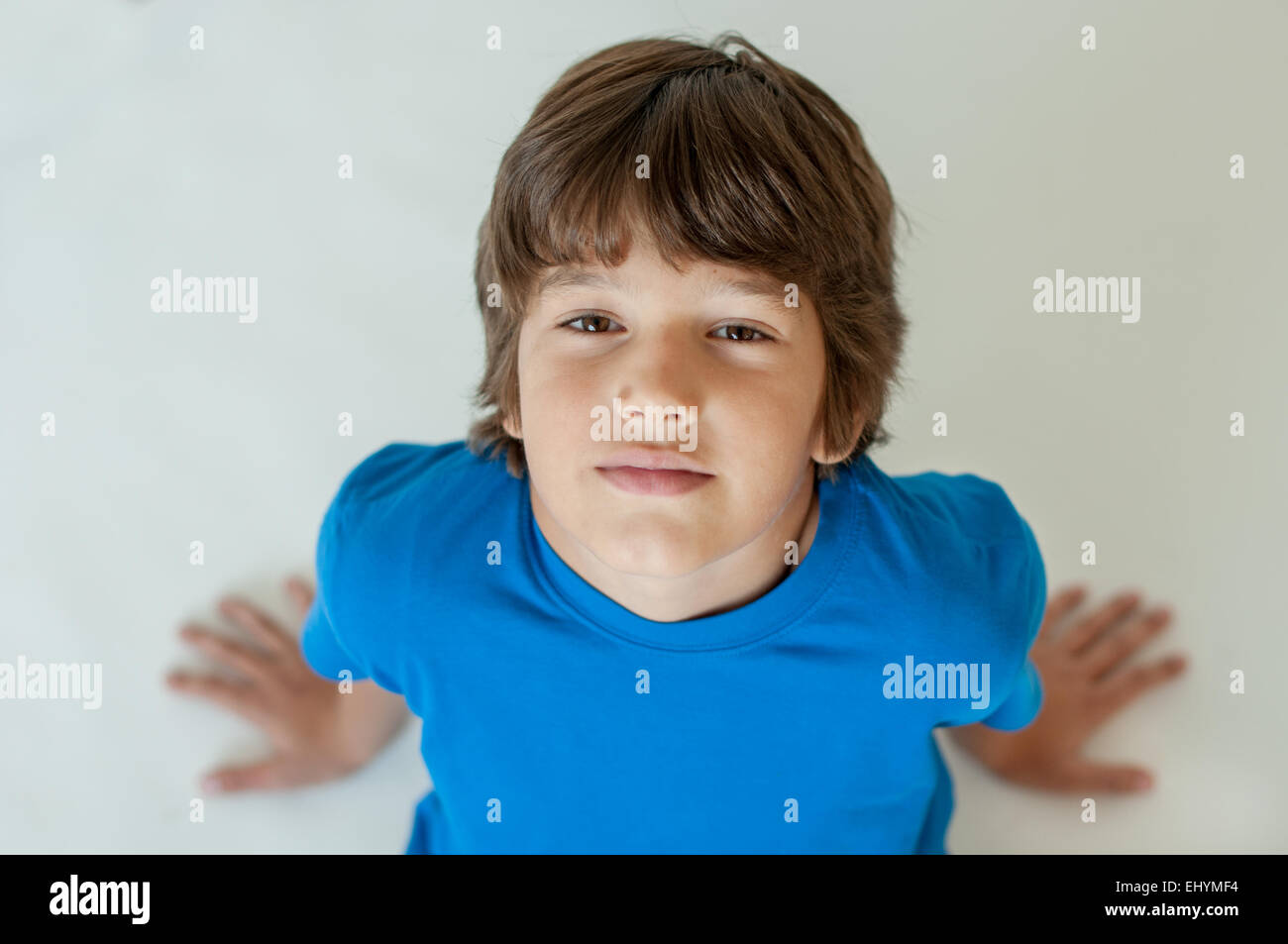 Portrait of a boy looking up at the camera Stock Photo