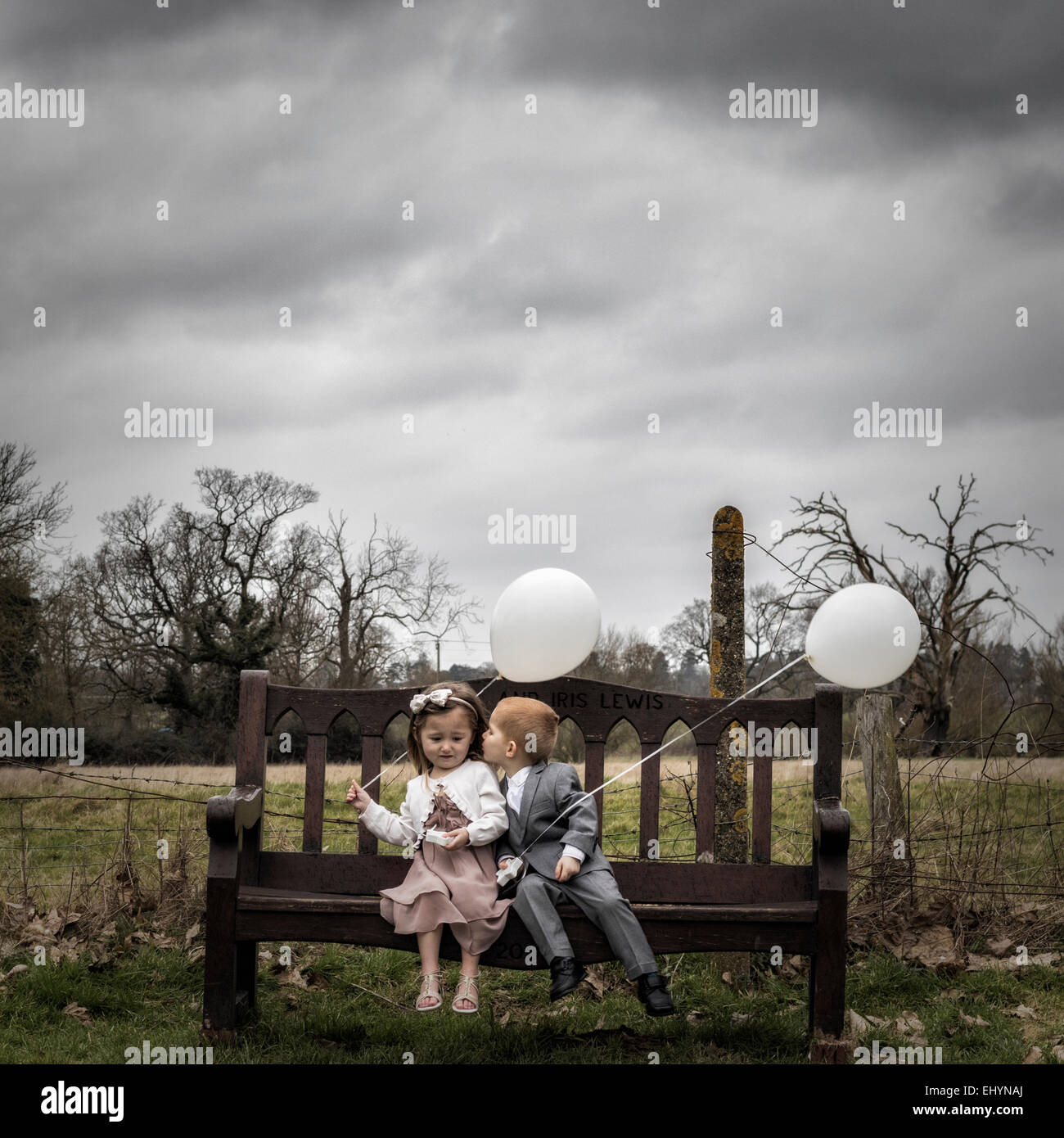 Boy trying to kiss a girl Stock Photo