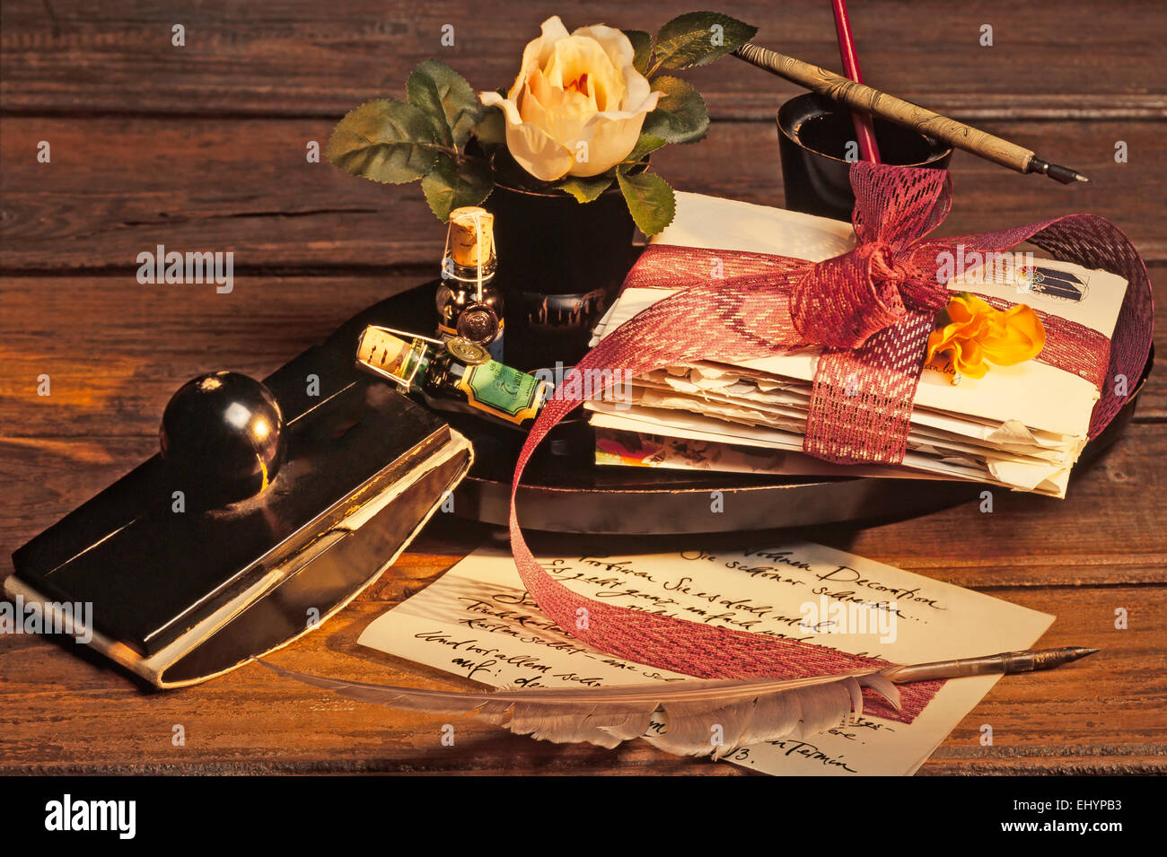 Old writing utensils, around 1900, with quill, fountain pen and letters
