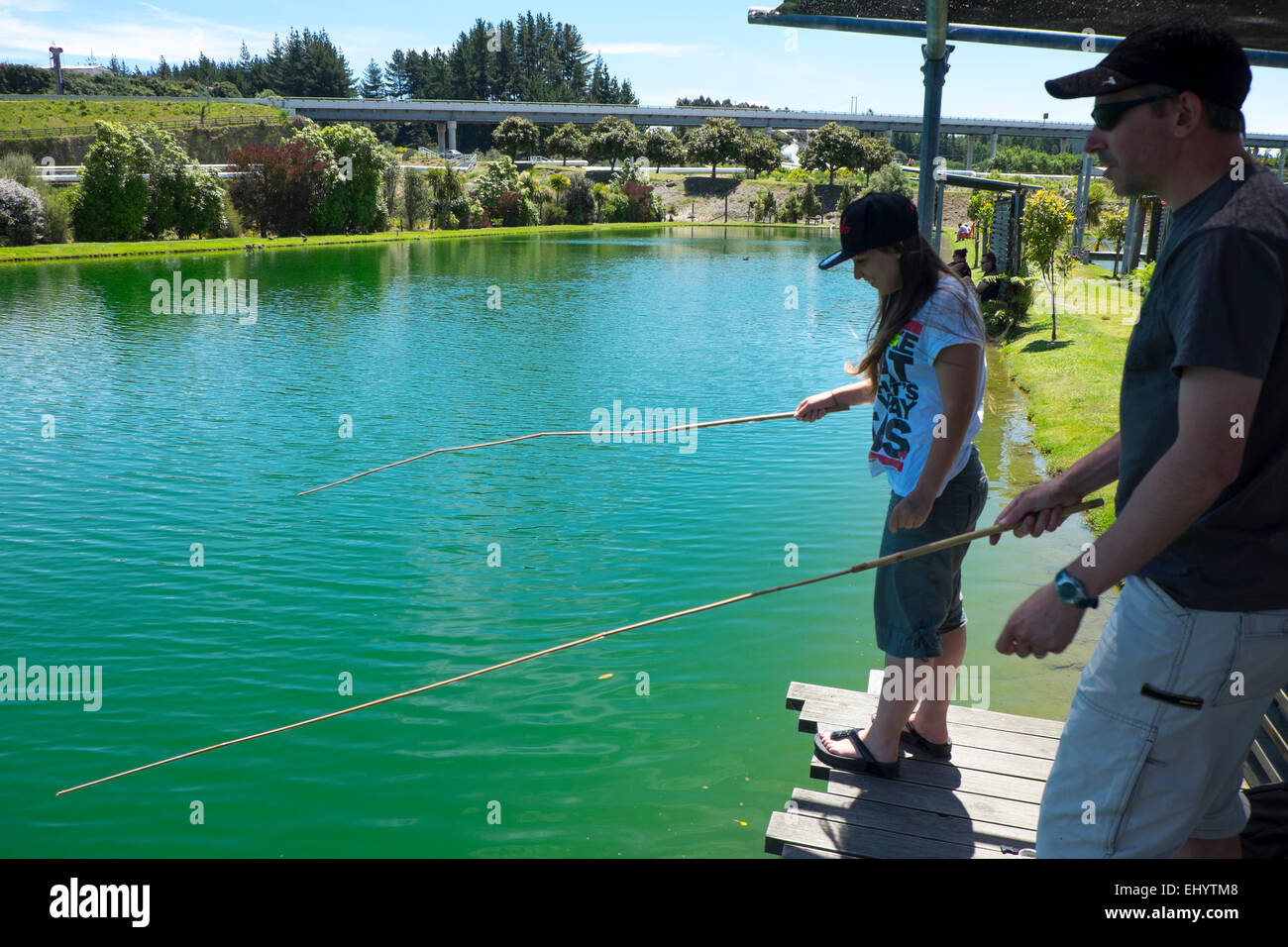 Fishing for prawns a the Huka Prawn Park, Taupo, North Island, New Zealand Stock Photo