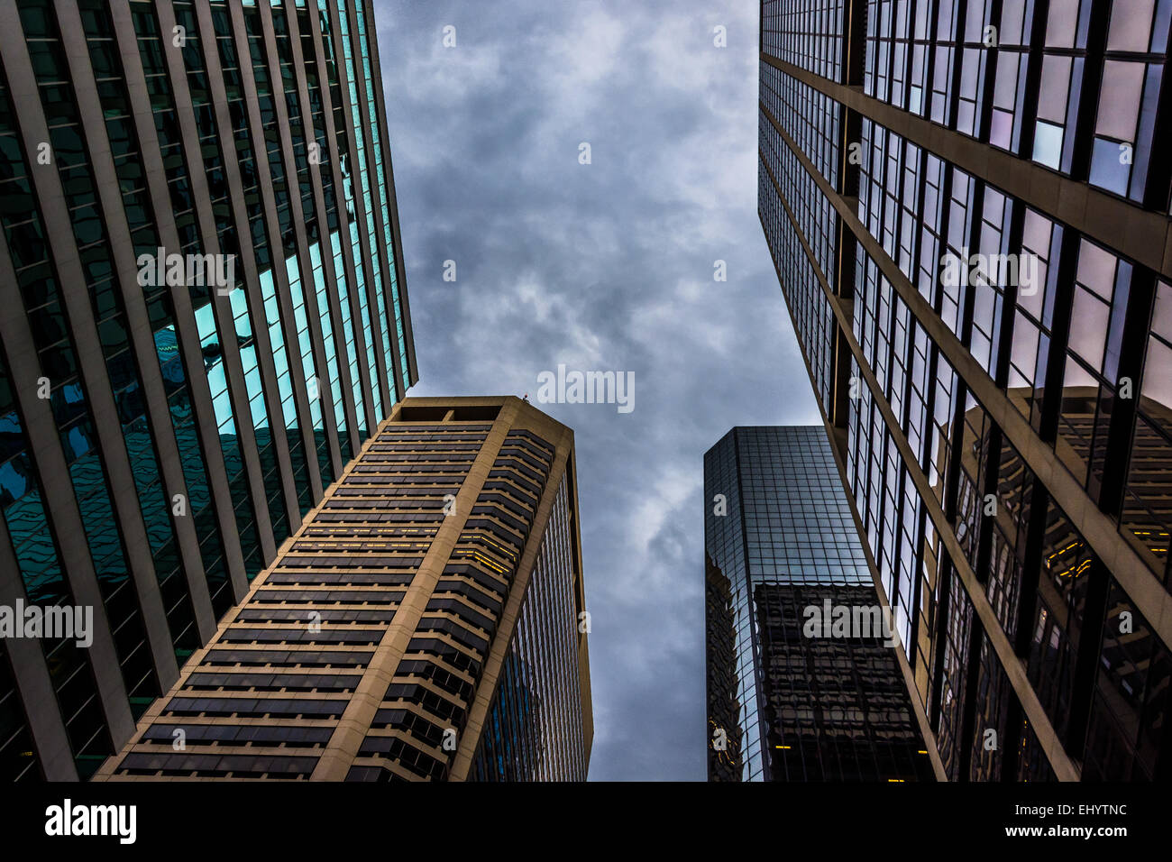 Looking up at modern buildings and a stormy sky in Philadelphia ...