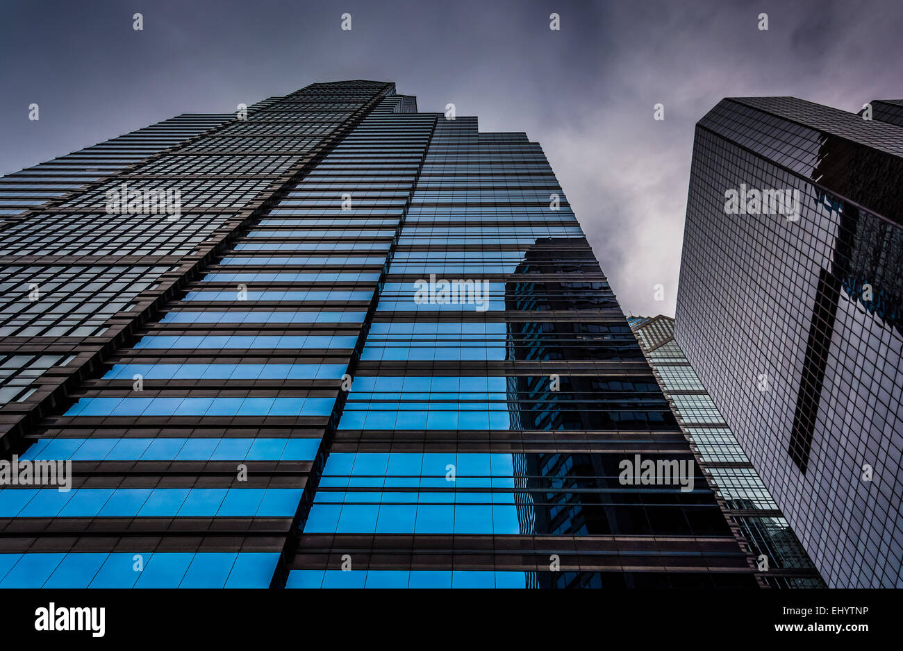Looking up at modern buildings under a cloudy sky in Philadelphia ...