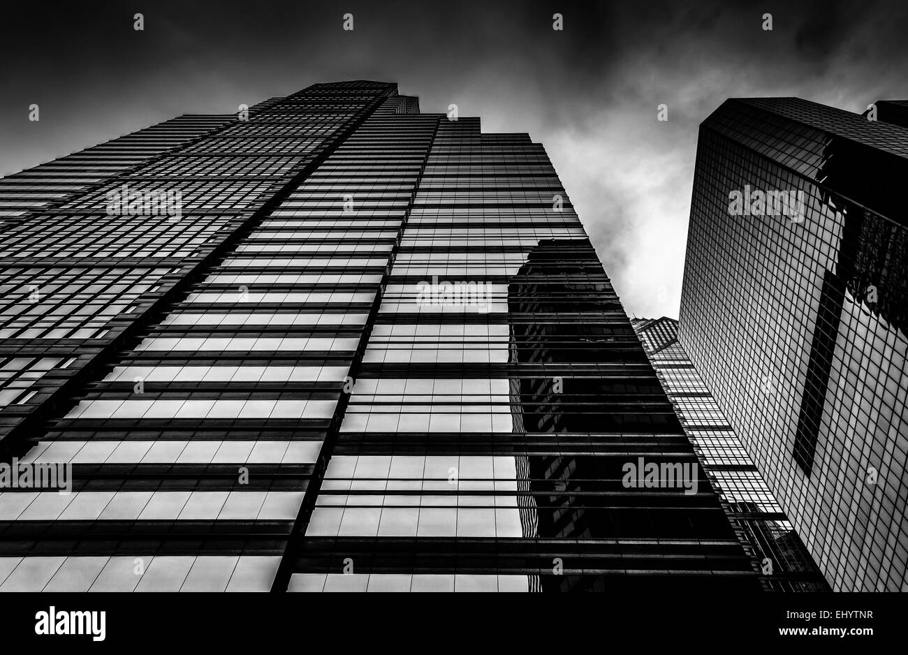 Looking up at modern buildings under a cloudy sky in Philadelphia ...