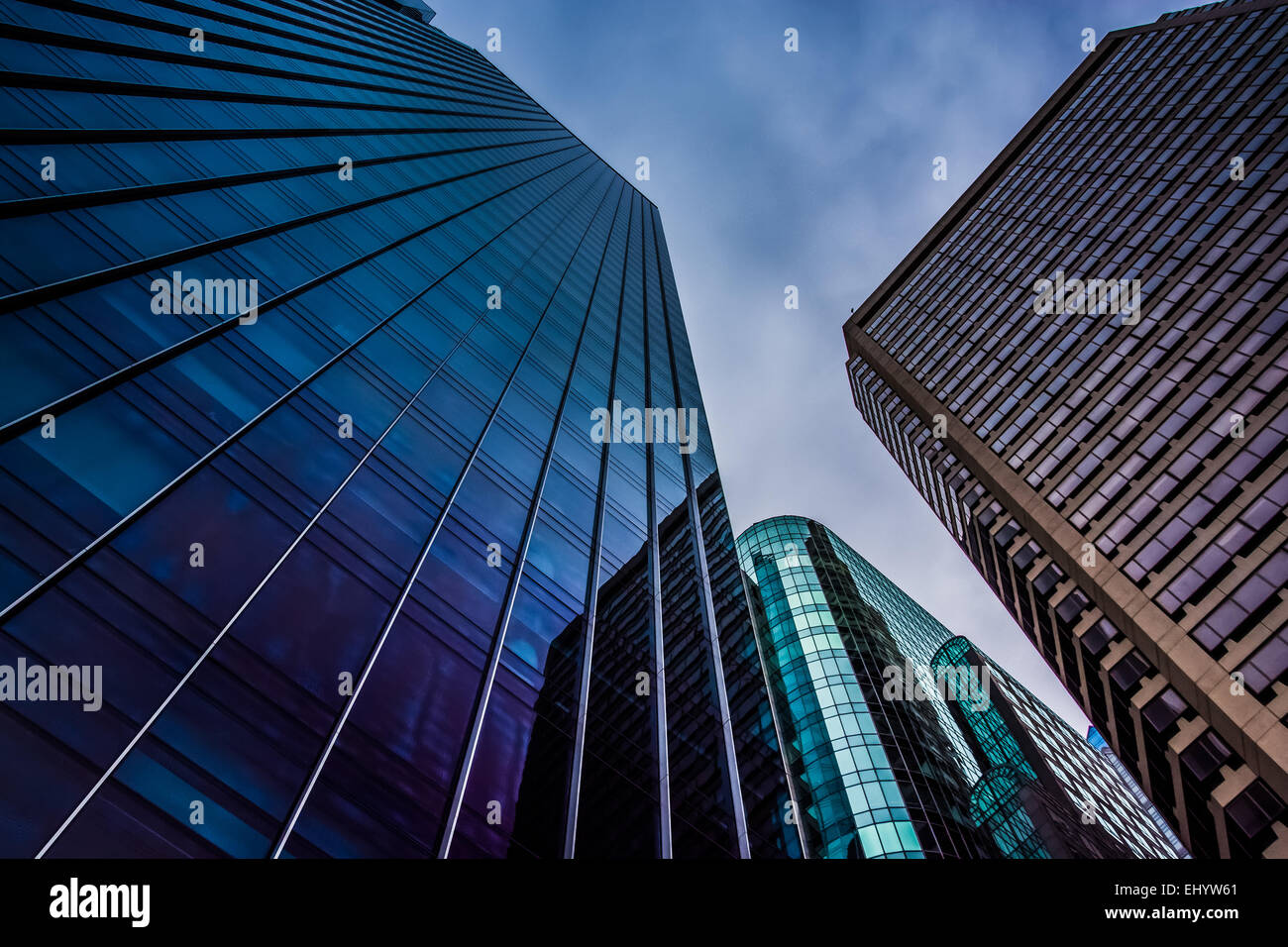 Looking up at modern buildings under a cloudy sky in Philadelphia ...
